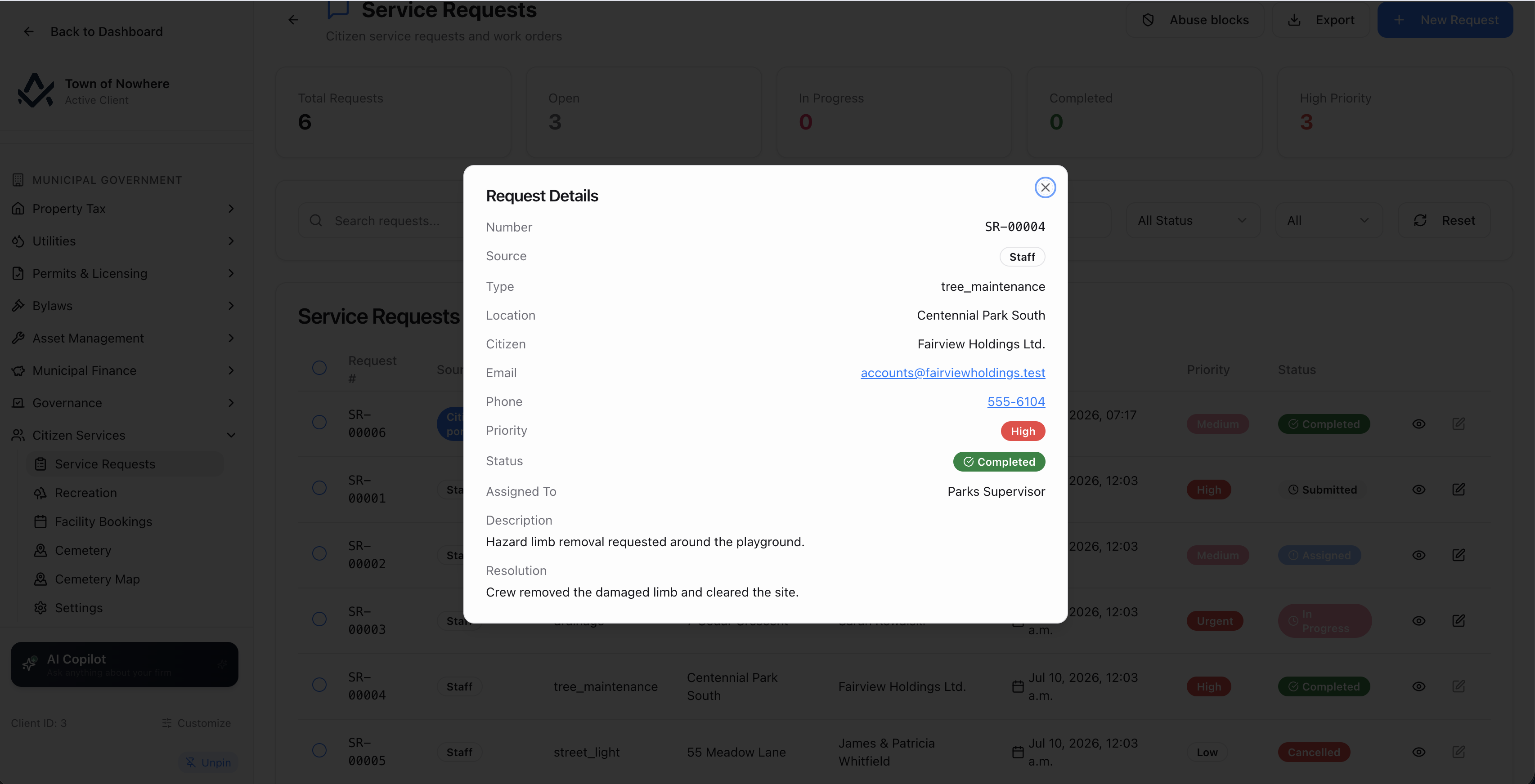 Service request detail showing reporters, attachments, status history and the linked work order
