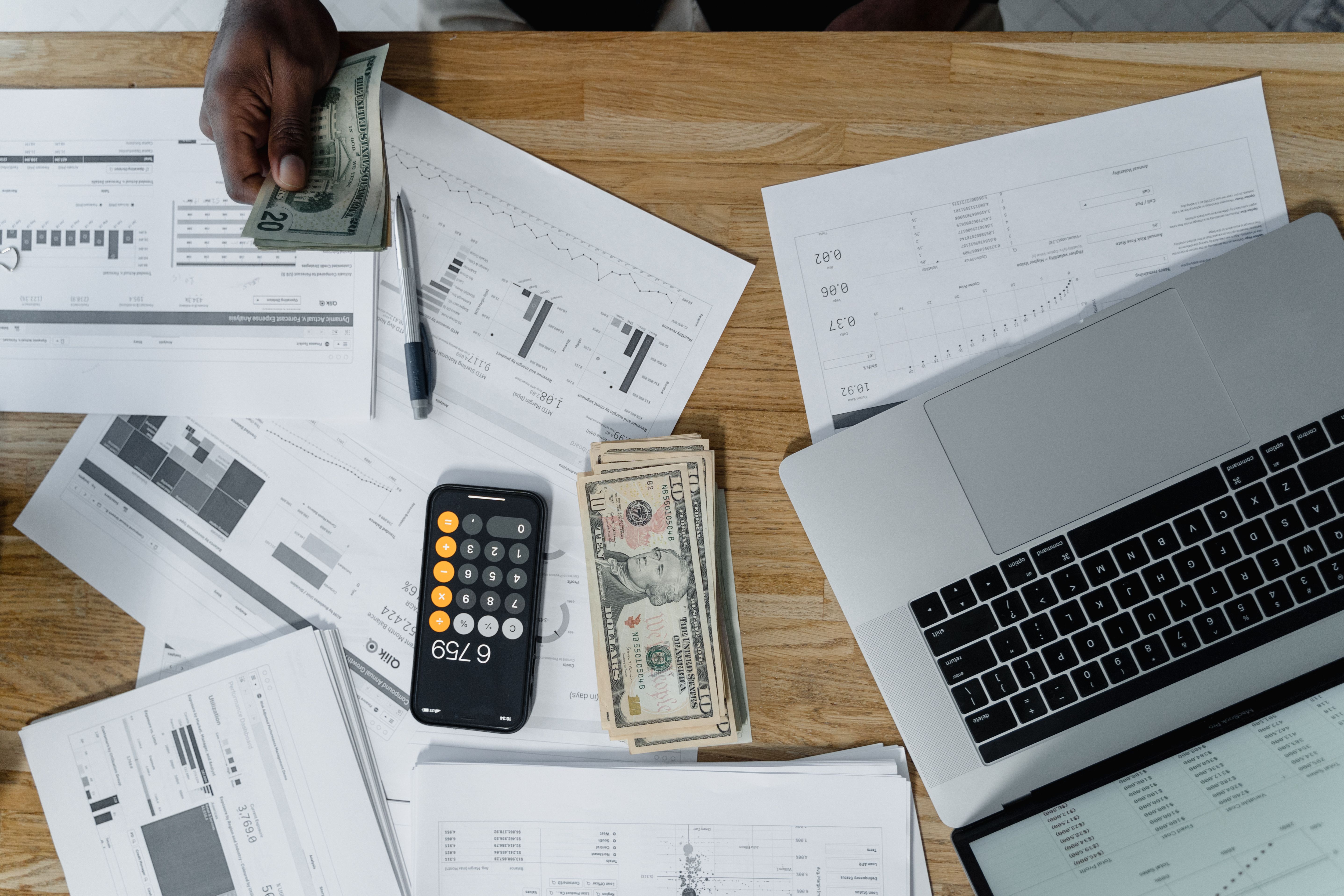 A close-up of a T2 corporate tax return form on a desk with a calculator and pen.